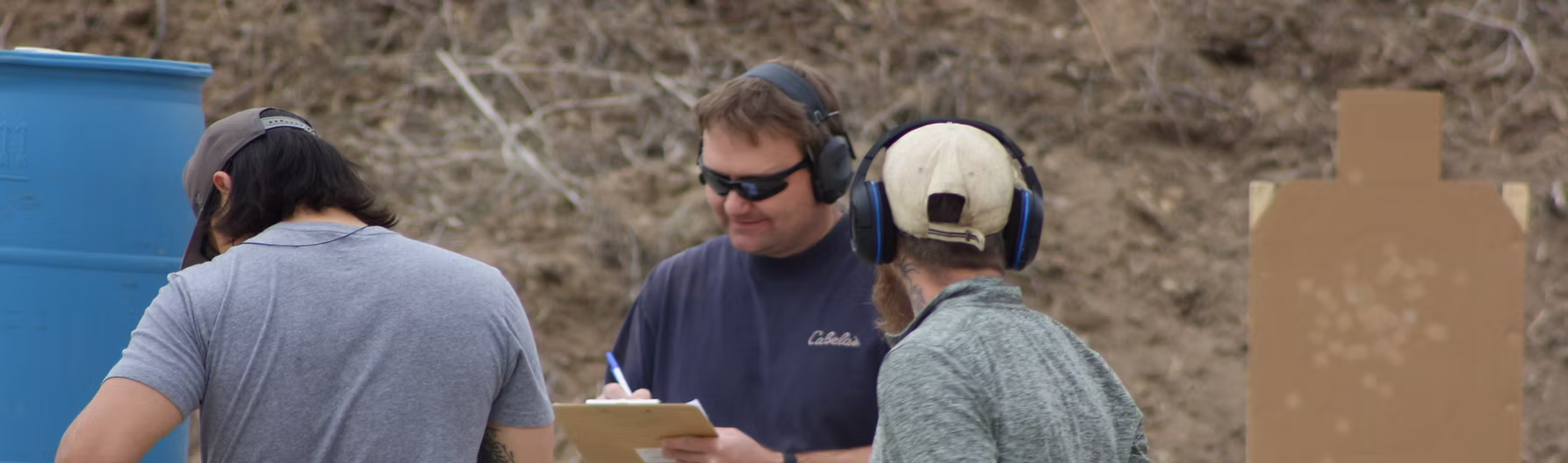 Shooters at the Kiowa Gun Club range